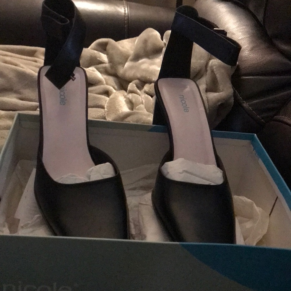 Black buckle ankle strap heels. Never worn.